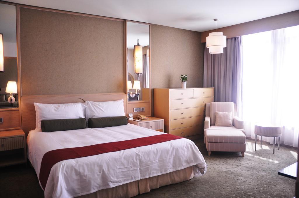 Hotel Nikko טיאנג'ין מראה חיצוני תמונה A bedroom at the hotel